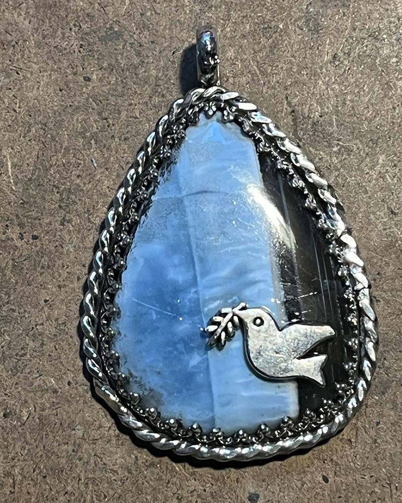 A blue stone with a bird on it