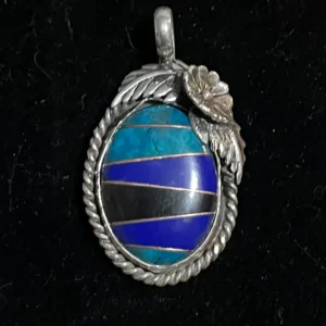 A blue and black stone in a silver frame.