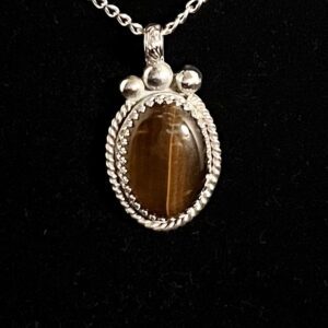 Silver chain with brown tiger eye pendant.