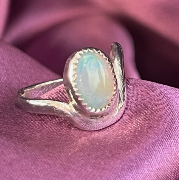 Silver ring with an opal stone.